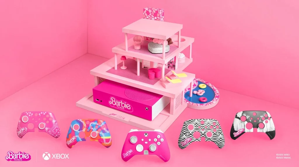 ação da Microsoft Xbox em torno do tema Barbie nos games com a casa da Barbie rodeada por controles de Xbox em tons predominantemente rosa